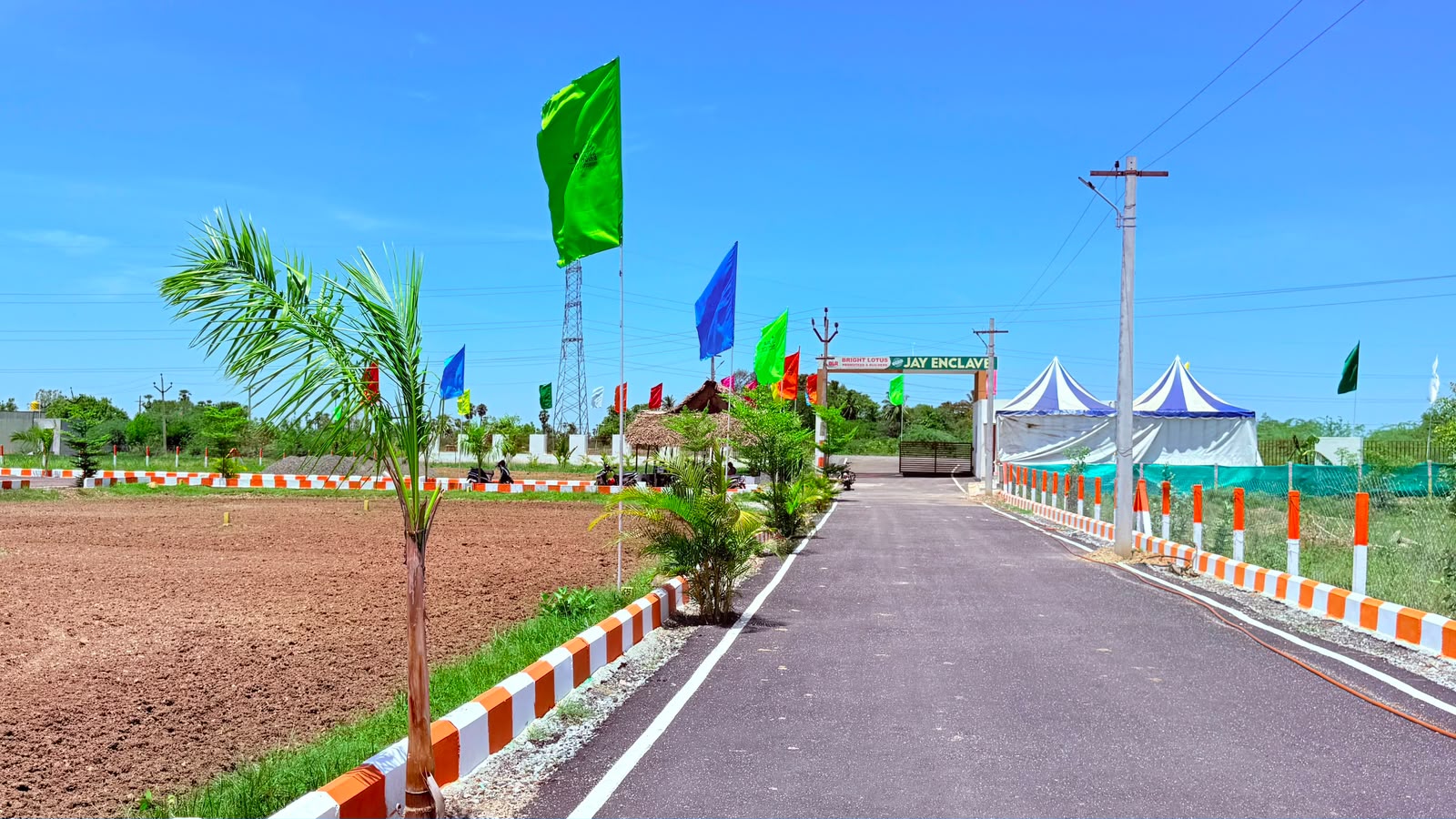 Jay Enclave entrance arch and blacktop approach road